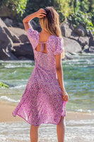 Robe mi-longue à imprimé floral et nœud papillon